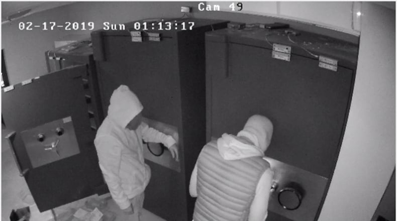 Atlanta police are looking for two masked gunmen who stole from the Icebox jewelry store in Buckhead as shown in this still image from store surveillance footage.