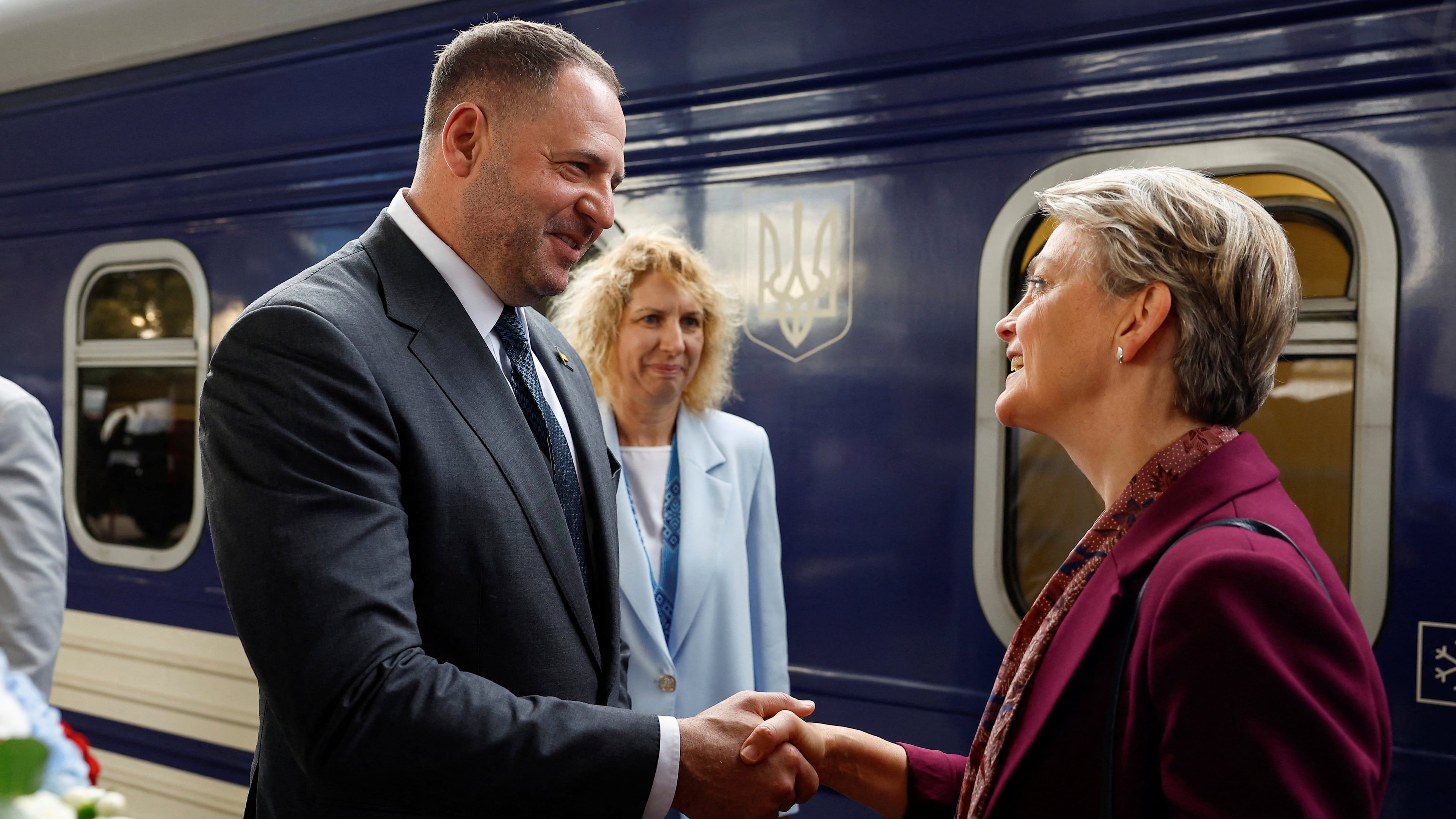 Head of the Office of the President of Ukraine Andriy Yermak, left, shakes hands with British Foreign Secretary Yvette Cooper upon her arrival at a railway station, amid Russia's attack on Ukraine, in Kyiv, Ukraine, Friday Sept. 12, 2025. (Valentyn Ogirenko/Pool Photo via AP)