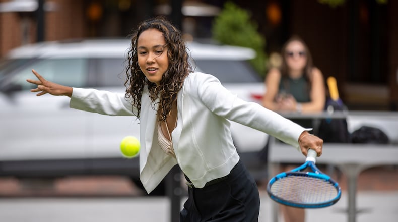 Canadian tennis player Leylah Fernandez volleys with the official Ball Kids before the start of the Atlanta Open Media Day on Tuesday at Atlantic Station. (Steve Schaefer / steve.schaefer@ajc.com)