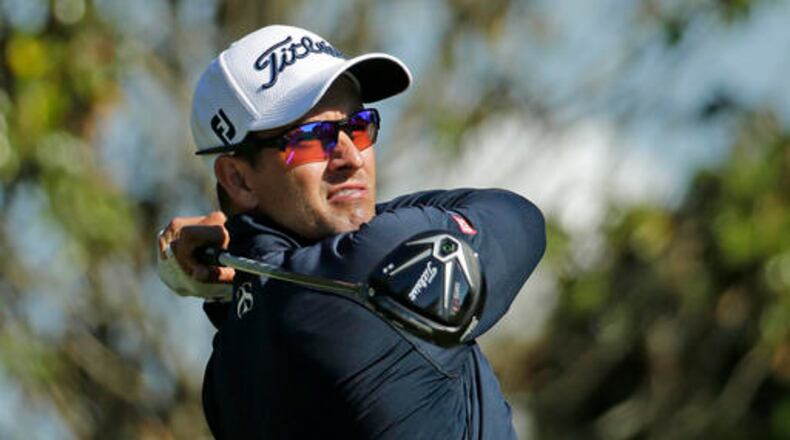 Adam Scott watches his tee shot on the 16th hole during the second round of the Wells Fargo Championship golf tournament at Quail Hollow Club in Charlotte, N.C., Friday, May 6, 2016. (AP Photo/Chuck Burton)