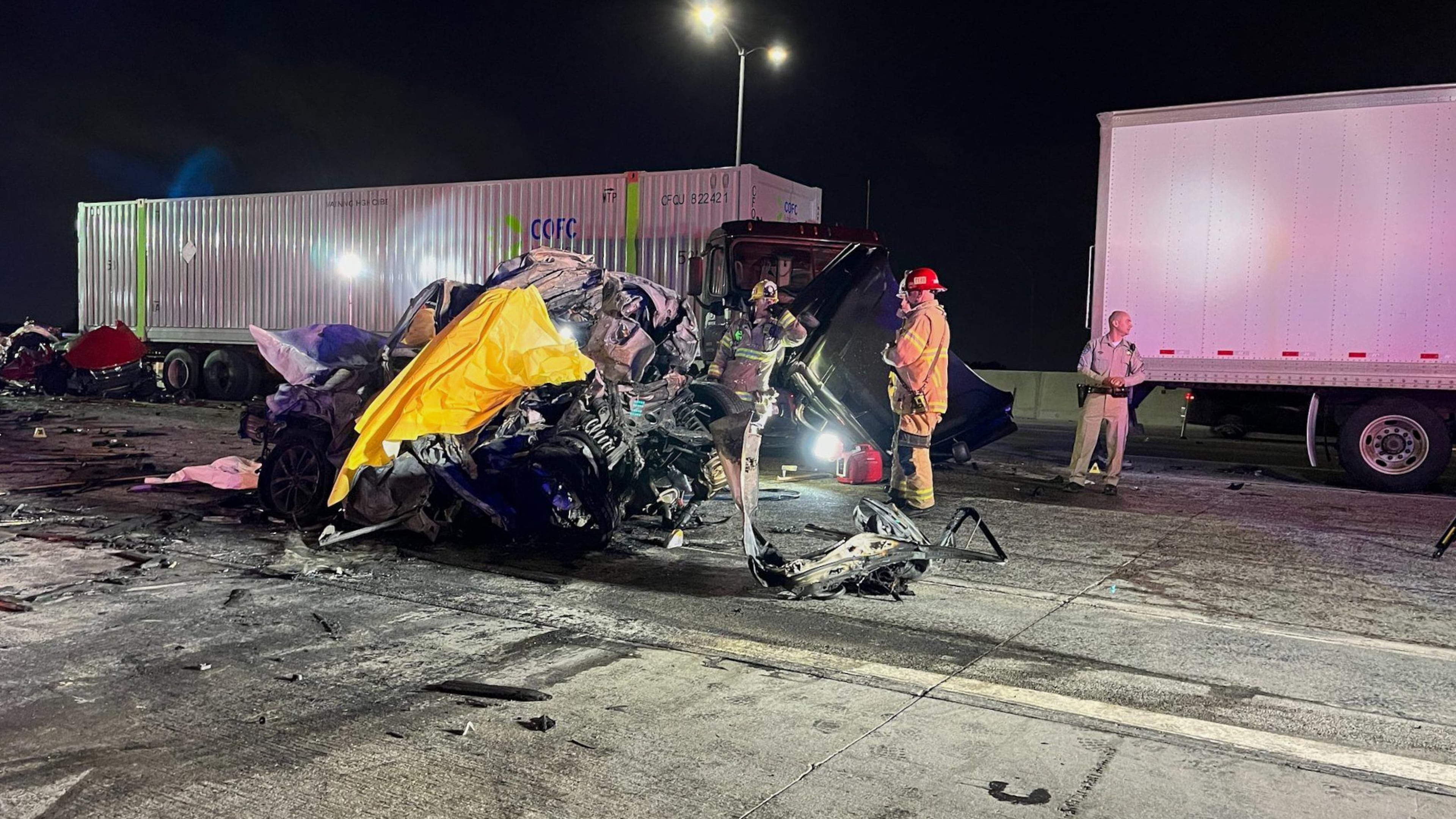 In this photo provided by the San Bernardino County District Attorney’s Office High Tech Crimes Unit, shows officials processing the scene of a deadly multi-vehicle crash Tuesday, Oct. 21, 2025, in Ontario, Calif. (San Bernardino County District Attorney’s Office High Tech Crimes Unit via AP)