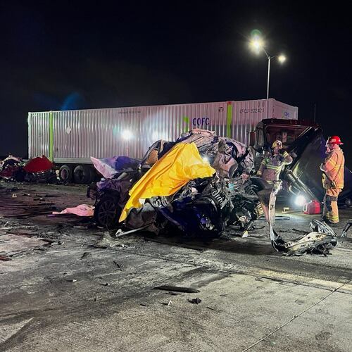 In this photo provided by the San Bernardino County District Attorney’s Office High Tech Crimes Unit, shows officials processing the scene of a deadly multi-vehicle crash Tuesday, Oct. 21, 2025, in Ontario, Calif. (San Bernardino County District Attorney’s Office High Tech Crimes Unit via AP)