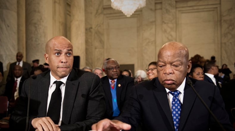 U.S. Sen. Cory Booker, D-N.J., left, and Rep. John Lewis, D-Ga., testify on Capitol Hill in Washington on Wednesday at the second day of a confirmation hearing for Attorney General-designate, Sen. Jeff Sessions, R-Ala., before the Senate Judiciary Committee. AP/Cliff Owen