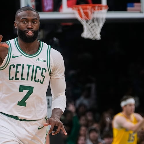 Boston Celtics guard Jaylen Brown celebrates after making a 3-point basket during the second half of an NBA basketball game against the Los Angeles Lakers, Friday, Dec. 5, 2025, in Boston. (AP Photo/Charles Krupa)