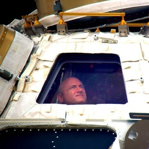 FILE - In this undated photo provided by NASA on Tuesday, March 1, 2016, astronaut Scott Kelly looks out the cupola of the International Space Station. (NASA via AP, File)