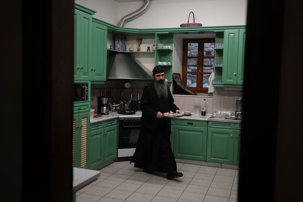 Father Serafeim, a Lebanese-Syrian, prepares coffee in the kitchen of Simonopetra, or the Simonos Petra Monastery, home of the all-male autonomous community Agion Oros, or Holy Mountain, on the peninsula of Mount Athos in northern Greece, Monday, April 14, 2025. (AP Photo/Thanassis Stavrakis)