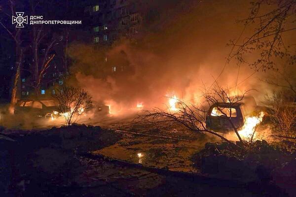 In this photo provided by the Ukrainian Emergency Service, cars burn following a Russian attack in Dnipro, Ukraine, Wednesday, April 9, 2025. (Ukrainian Emergency Service via AP)