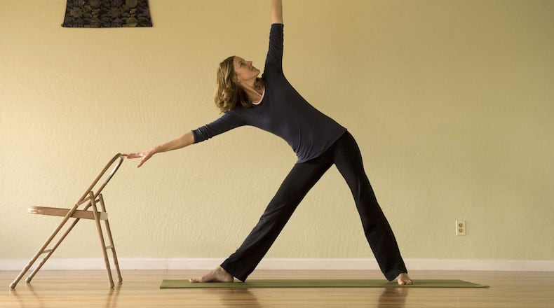 In addition to adding weights, you might also consider yoga to relieve back pain. Some yoga poses are especially good for your back. Here, Kim Wagaman of Sacramento, Calif., teaches seminars for scoliosis suffers that provides specific poses and stretches to ease the painful back condition. (Michael Allen Jones/Sacramento Bee/MCT)