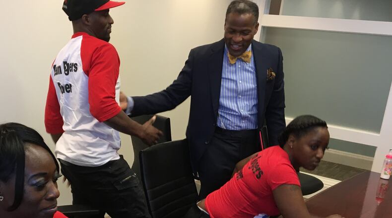 Attorney Keenan Nix (right), with siblings of the late Sonny Rogers, who was injured during construction of Mercedes-Benz Stadium. Rogers died from his injuries in July.