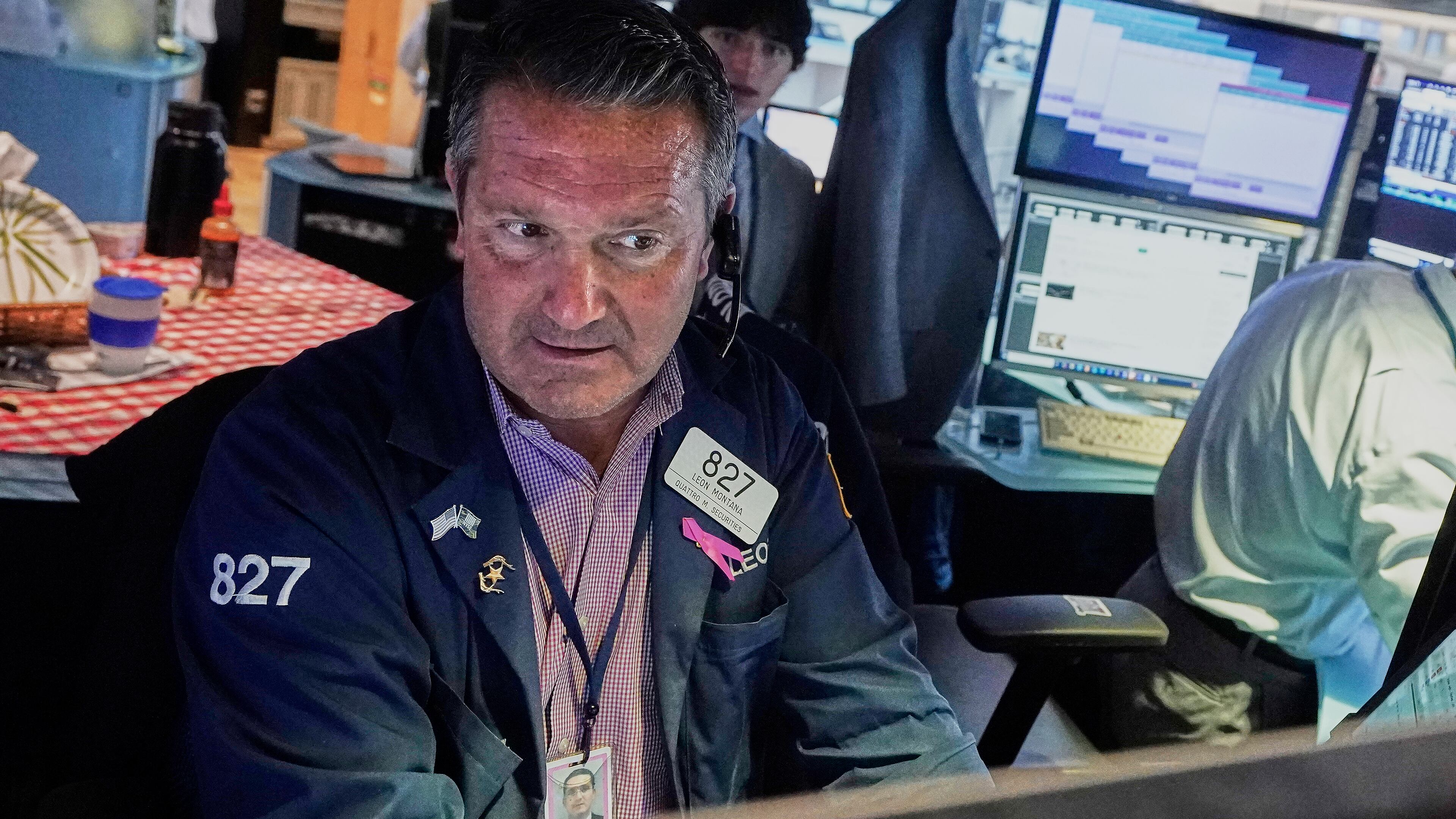 Trader Leon Montana works on the floor of the New York Stock Exchange, Tuesday, July 29, 2025. (AP Photo/Richard Drew)