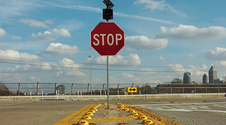 Now, near the crash scene, there are new flashing stoplights at the Northside HOV lane exit in Atlanta. (ELISSA EUBANKS/STAFF)