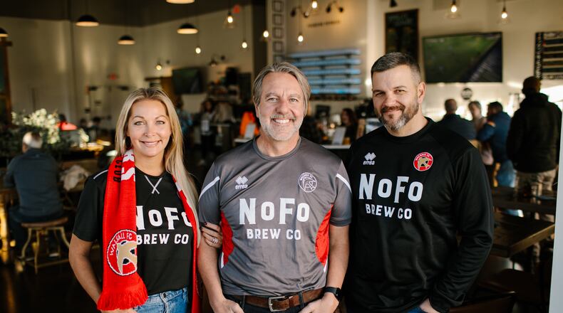 Shannon Miles (from left), Bryan Miles and Joe Garcia are founders of NoFo Brew Co. Shannon and Bryan Miles also are among the owners of the Walsall football club in England. (Courtesy of Andy Brophy)