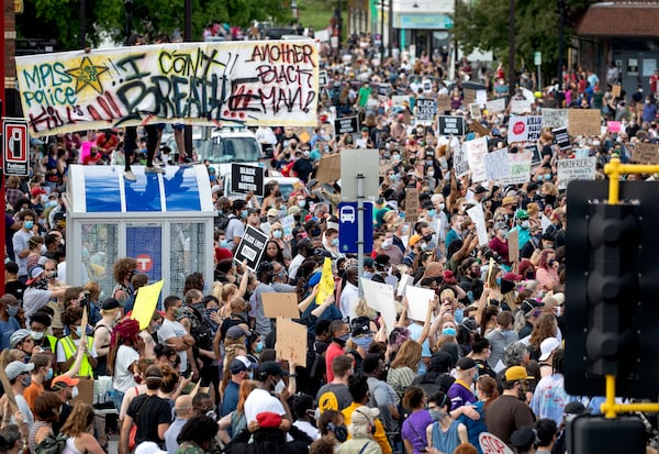 FILE - Protesters gather calling for justice for George Floyd on Tuesday, May 26, 2020, in Minneapolis. Four Minneapolis officers involved in the arrest of Floyd, a black man who died in police custody, were fired Tuesday, hours after a bystander's video showed an officer kneeling on the handcuffed man's neck, even after he pleaded that he could not breathe and stopped moving. (Carlos Gonzalez/Star Tribune via AP, file)