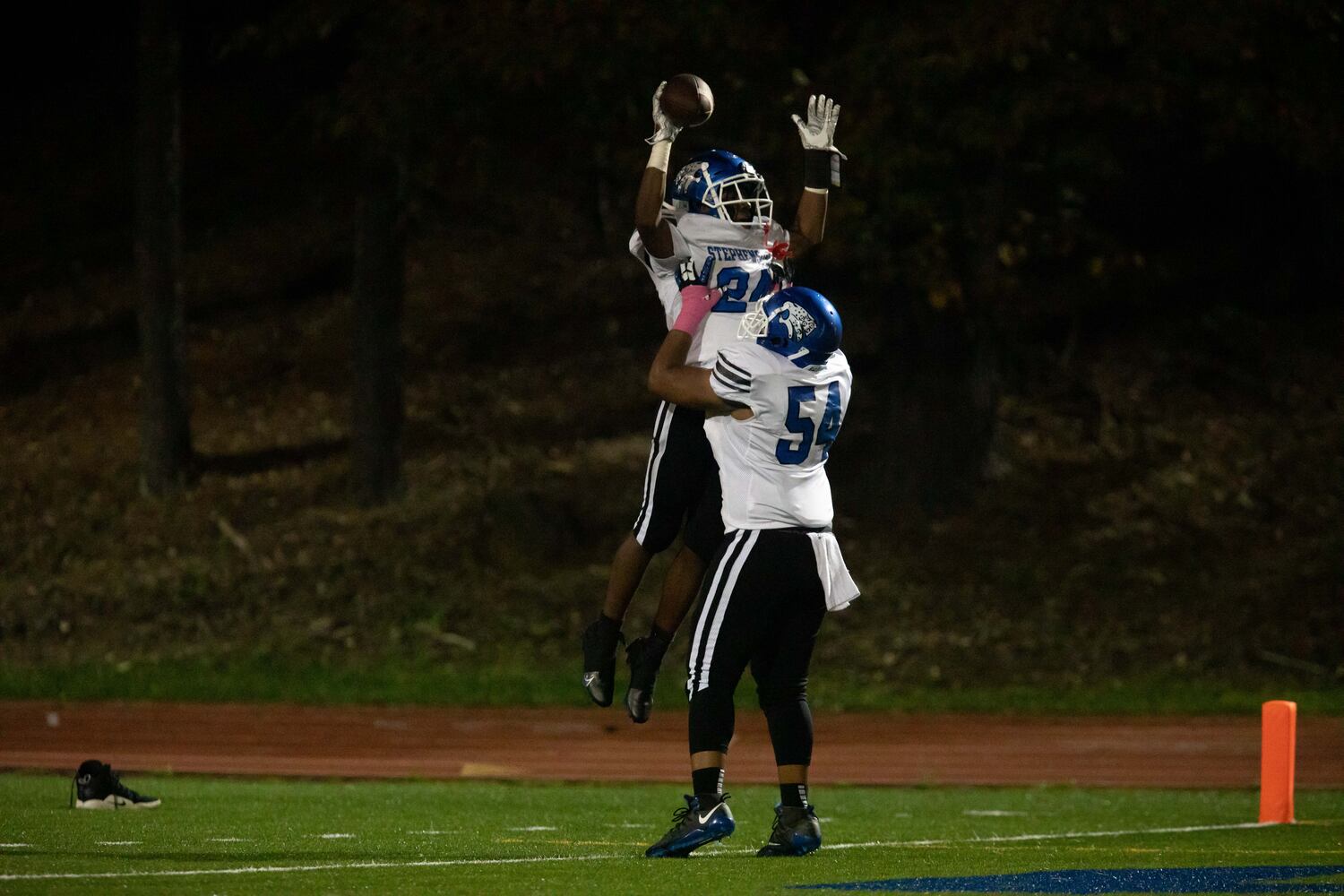 Stephenson's Devin Ingram (24) and Dakarai Smith (54) celebrate a touchdown during a GHSA high school football game between Stephenson High School and Miller Grove High School at James R. Hallford Stadium in Clarkston, GA., on Friday, Oct. 8, 2021. (Photo/Jenn Finch)