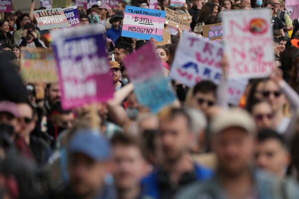 Campaigners take part in a rally organised by trans rights groups, trade unions, and community organisations following the Supreme Court ruling on the definition of a woman in equalities law, at Parliament Square, central London, Saturday April 19, 2025. (AP Photo/Alastair Grant)
