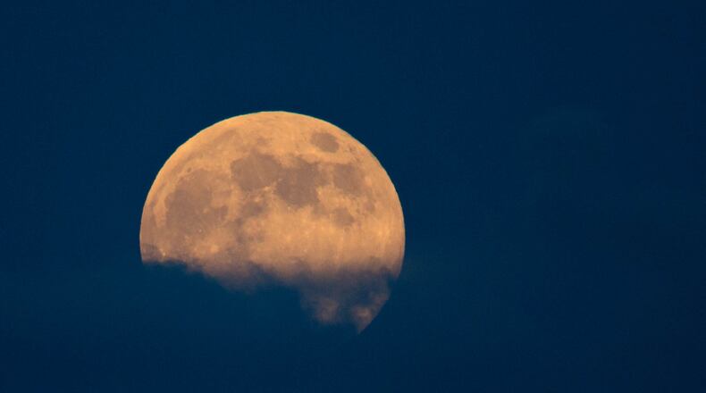 A super moon rises over the Boynton Beach Inlet in Boynton Beach, Florida on September 8, 2014. (Allen Eyestone / The Palm Beach Post)