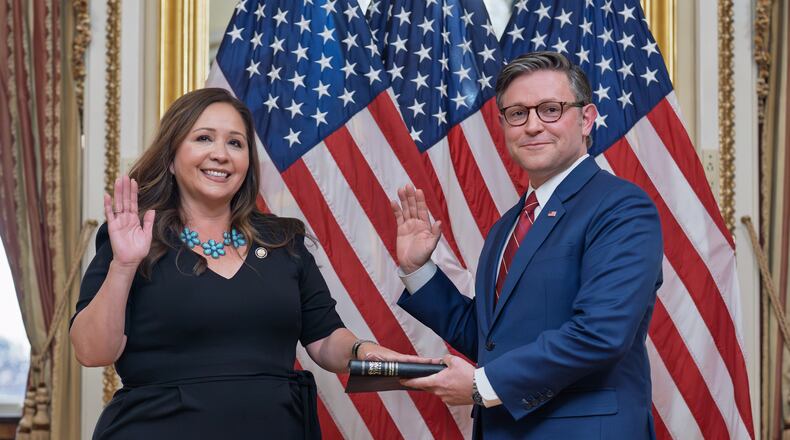 Speaker of the House Mike Johnson, R-La., holds a ceremonial swearing-in for Rep. Adelita Grijalva, D-Ariz., left, at the Capitol in Washington, Wednesday, Nov. 12, 2025. (AP Photo/J. Scott Applewhite)