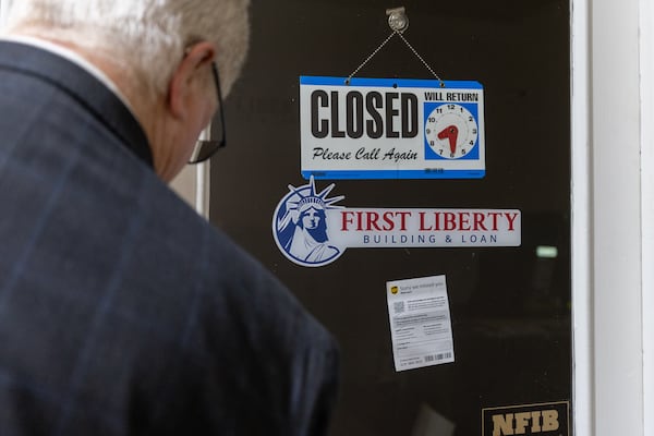 S. Gregory Hays, the court-appointed receiver for First Liberty Building & Loan, opens the door to the office in Newnan on Wednesday, July 16, 2025. The SEC has sued First Liberty for allegedly defrauding investors. (Arvin Temkar/AJC)