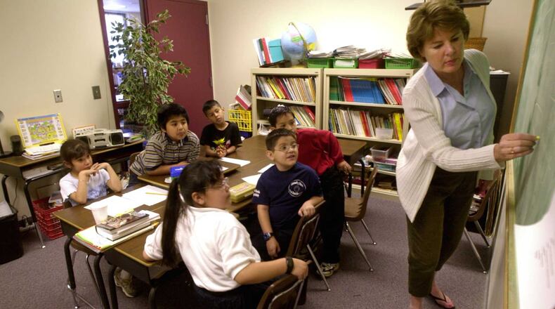 From 2001: Dell Boettger, right, teaches an ESOL class at Park Street Elementary in what was once a teacher conference room. There were many cramped classrooms that year, whern the school had more than 800 students.