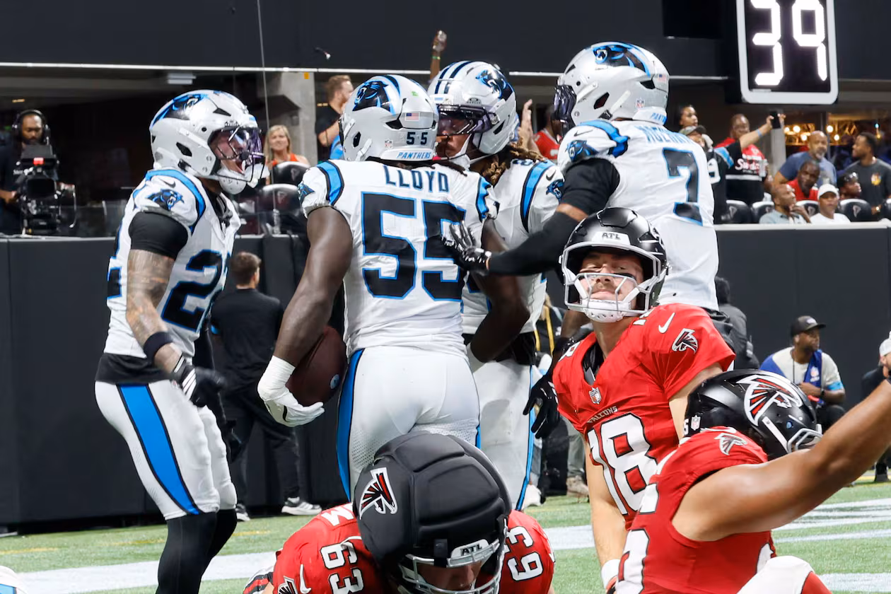 Atlanta Falcons quarterback Jack Strand (18), center, kneeling as the Carolina Panthers celebrate a touchdown after a fumble recovery during the second half of an NFL game at Mercedes-Benz Stadium in Atlanta on Sunday, Sept. 20, 2026. (Miguel Martinez/AJC)