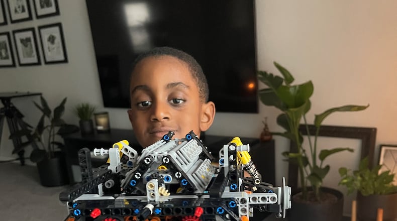 Ethan Williams with a completed Lego set.