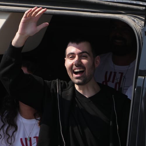 FILE - Freed Israeli hostage Guy Gilboa-Dalal gestures from a van as he arrives at Beilinson hospital in Petah Tikva, Israel, after he was released from Hamas captivity in the Gaza Stripl, Monday, Oct. 13, 2025. (AP Photo/Ariel Schalit, File)