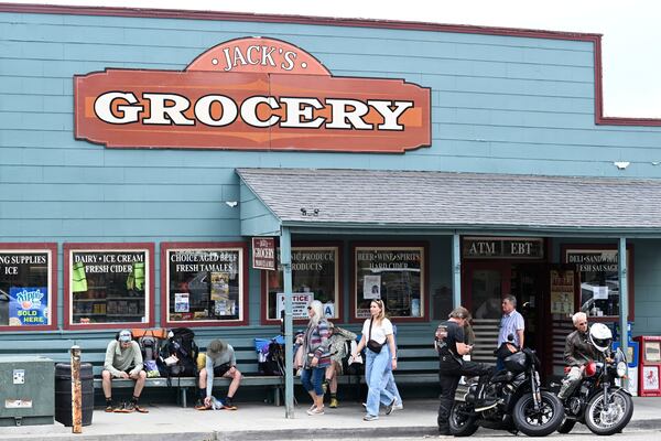 People walk on the main street Monday, April 14, 2025, in Julian, Calif., after an earthquake shook Southern California, sending boulders tumbling onto rural roadways outside San Diego and rattling items off shelves and walls. (AP Photo/Denis Poroy)