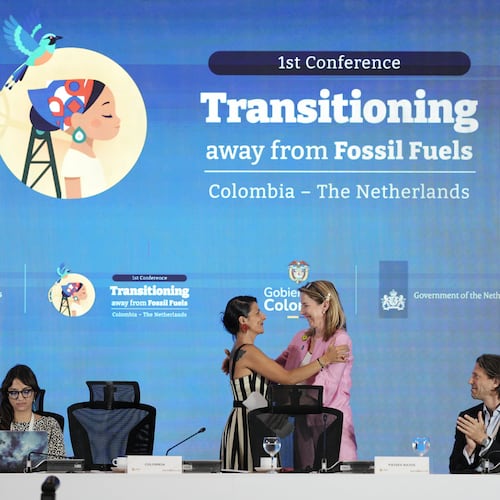 Stientje van Veldhoven, Minister of Climate Policy and Green Growth of the Netherlands, right, embraces Colombia's Environmental Minister Irene Vélez Torres during a conference aimed at transitioning away from fossil fuels Tuesday, April 28, 2026, in Santa Marta, Colombia. (AP Photo/Ivan Valencia)