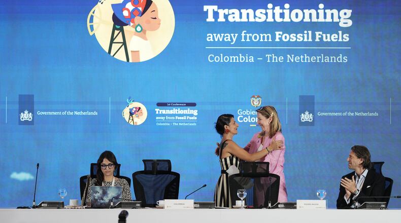 Stientje van Veldhoven, Minister of Climate Policy and Green Growth of the Netherlands, right, embraces Colombia's Environmental Minister Irene Vélez Torres during a conference aimed at transitioning away from fossil fuels Tuesday, April 28, 2026, in Santa Marta, Colombia. (AP Photo/Ivan Valencia)