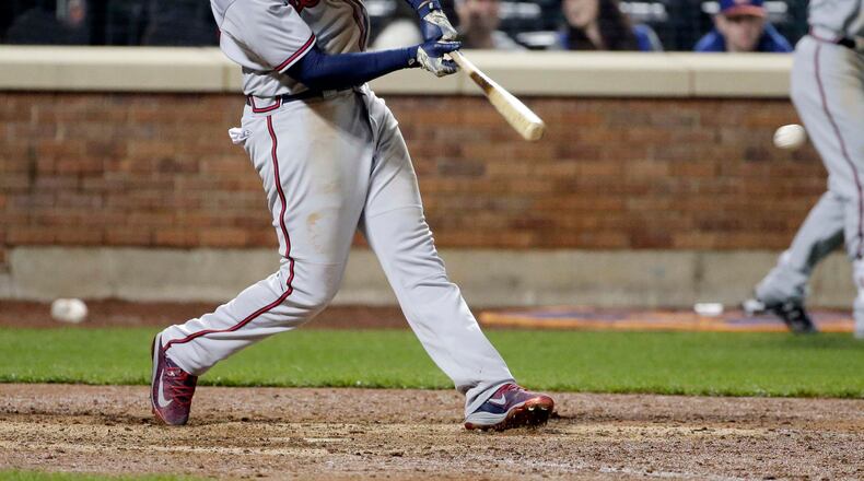 Atlanta Braves' Matt Kemp hits a two-run RBI double during the twelfth inning of a baseball game against the New York Mets, Wednesday, April 5, 2017, in New York. (AP Photo/Frank Franklin II)
