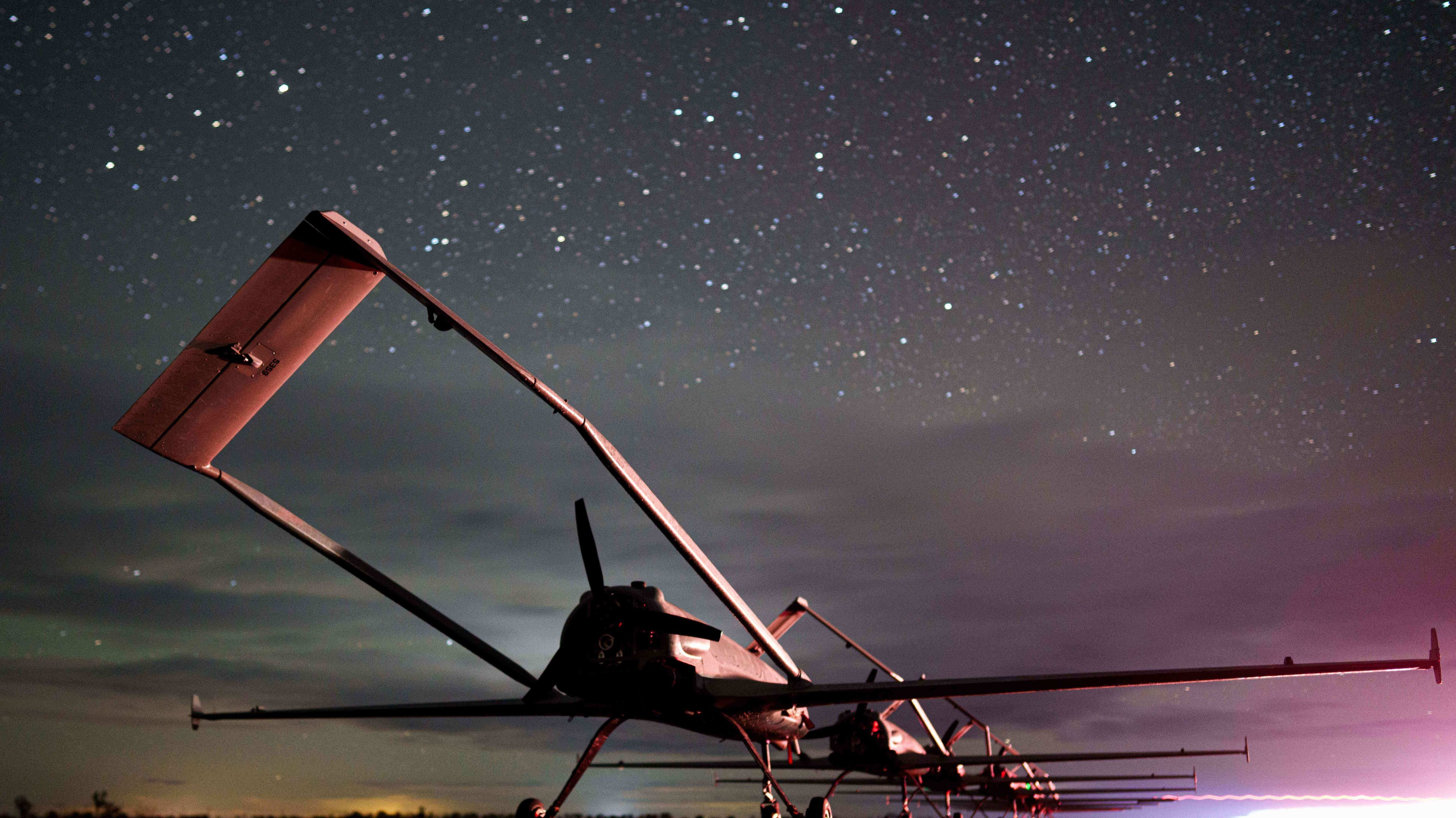 Long-range drones An-196 Liutyi of the Ukrainian 14th Separate Unmanned Aerial Systems Regiment stand in line before takeoff in undisclosed location, Ukraine, Tuesday, Oct. 14, 2025. (AP Photo/Evgeniy Maloletka)