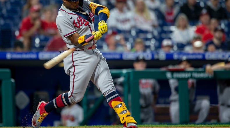 Atlanta Braves' Ronald Acuna Jr. hits a home run during the third inning of a baseball game against the Philadelphia Phillies, Tuesday, June 8, 2021, in Philadelphia. (AP Photo/Laurence Kesterson)