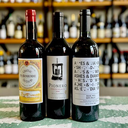 Red wine blend recommendations for the holiday season. Château Peybonhomme Les Tours Côtes de Blaye Bordeaux (left), Pionero Cosecha Selecta (center) and Ashes & Diamonds Rouge No. 6 (right). (Krista Slater for the AJC)