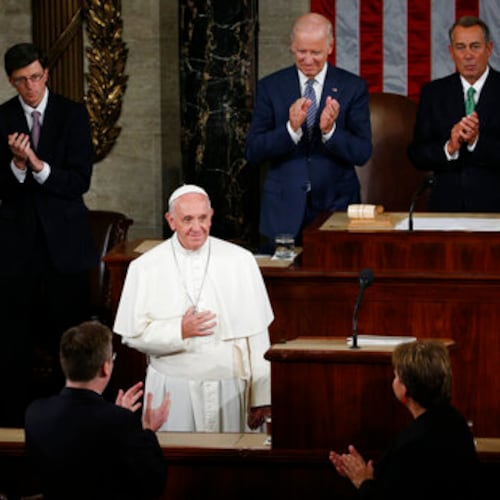 FILE - US Vice President Joe Biden, second from right at top, and House Speaker John Boehner of Ohio and others applaud Pope Francis as he arrives to address a joint meeting of Congress on Capitol Hill in Washington, making history as the first pontiff to do so, Thursday, Sept. 24, 2015. (AP Photo/Carolyn Kaster, file)