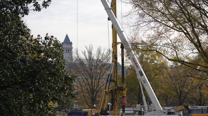 Construction of a new ballroom continues on the East Wing of the White House, Tuesday, Nov. 23, 2025, in Washington. (AP Photo/Alex Brandon)