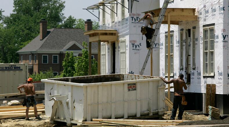 FILE - Luxury homes are under construction in a subdivision, May 22, 2007 in New Albany, Ohio. (AP Photo/Kiichiro Sato, File)