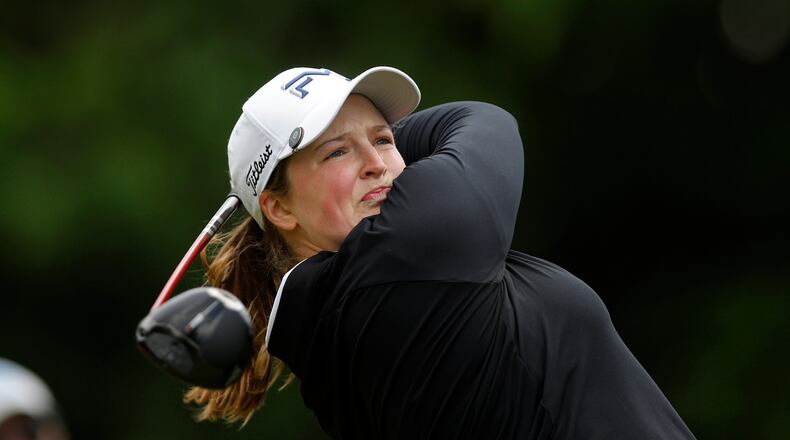 Lottie Woad, of England, watches her tee shot on the fourth hole during the first round of the Meijer LPGA Classic golf tournament, Thursday, June 18, 2026, in Belmont, Mich. (AP Photo/Al Goldis)