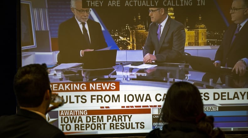 Supporters of Sen. Amy Klobuchar (D-Minn.) watch television news coverage of the Iowa caucuses during a caucus night party in Des Moines on Monday night, Feb. 3, 2020. Unexplained “inconsistencies” in Iowa caucus results, heated conference calls and firm denials of hacking left the contest in a strange state of almost suspended animation. (Pete Marovich/The New York Times)