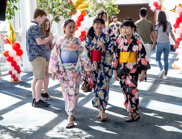People walk through the JapanFest looking over the various vendors at the Infinite Energy Center on Sunday, September 22, 2019. (Steve Schaefer/Special to the AJC) 