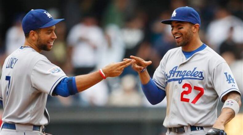 There won’t be a reunion with the Braves for former Dodgers teammates Matt Kemp, right, and James Loney. Loney asked for and was granted his release Monday, two days after the Braves traded for another first baseman, Matt Adams. (AP file photo/Lenny Ignelzi)