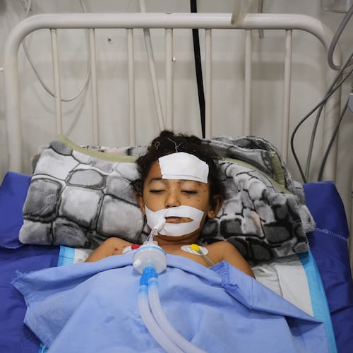 Nabila Shorbasi, who was injured by an unexploded ordnance along with her six-year-old twin brother Yahya, lies on a bed at Patient's Friends Charity Hospital in Gaza City, Saturday, Oct. 25, 2025. (AP Photo/Abdel Kareem Hana)