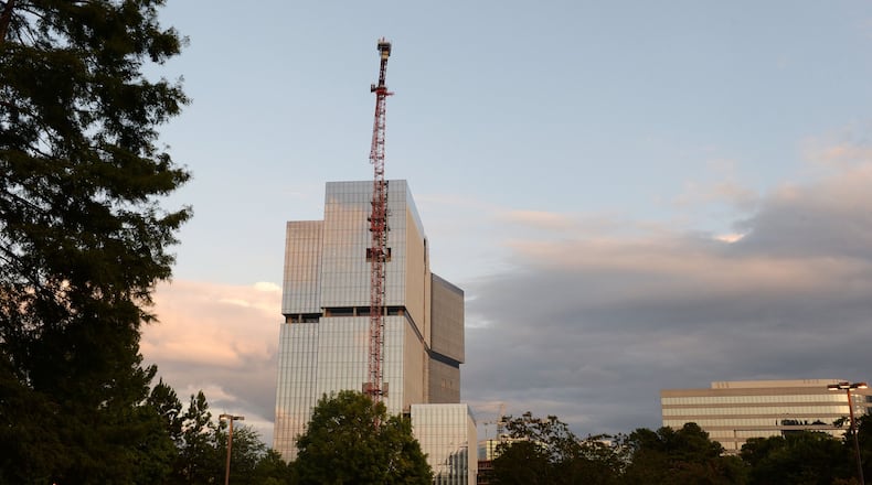 The first State Farm tower rises along Hammond Drive in Dunwoody. State Farm received nearly $34 million in tax incentives for two more office towers across the street. In all, the State Farm project is expected to house about 7,500 employees on a 17-acre campus near Perimeter Mall. KENT D. JOHNSON/kdjohnson@ajc.com