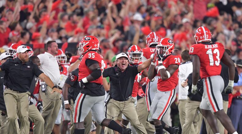The Georgia Bulldogs and coach Kirby Smart hope to have as much to celebrate at Sanford Stadium this year as they did against Notre Dame last year. (Hyosub Shin / Hyosub.Shin@ajc.com)