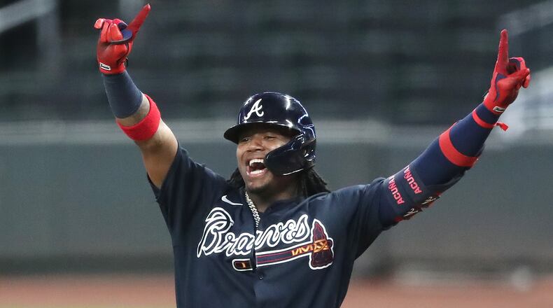 Braves outfielder Ronald Acuna reacts to hitting a single during the sixth inning of an intrasquad game Saturday, July 18, 2020 in Atlanta. Curtis Compton ccompton@ajc.com