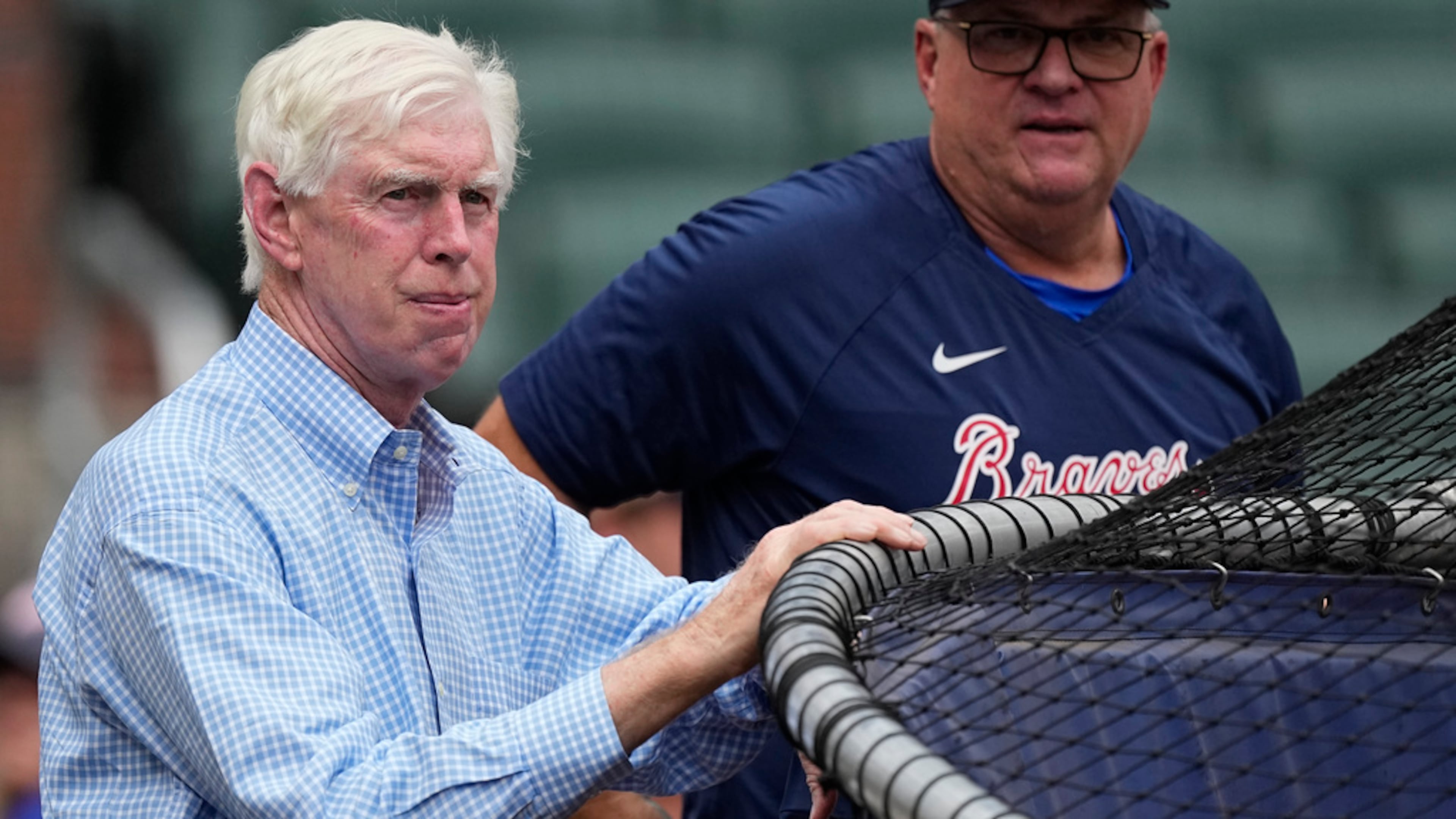 Braves chairman Terry McGuirk — pictured watching batting practice before a July 2023 game — said Wednesday of the team's 2026 player payroll plans: “I think I’ve stated in the past that our goals are to be a top-five salary team. … I think we are capable of doing that." (John Bazemore/AP 2023)