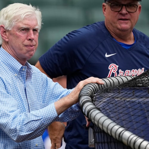 Braves chairman Terry McGuirk — pictured watching batting practice before a July 2023 game — said Wednesday of the team's 2026 player payroll plans: “I think I’ve stated in the past that our goals are to be a top-five salary team. … I think we are capable of doing that." (John Bazemore/AP 2023)