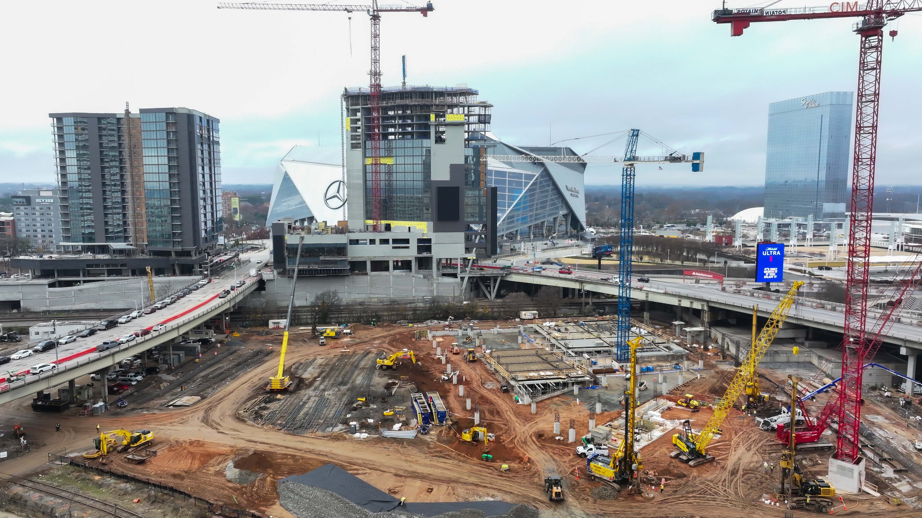 Centennial Yards construction was at full speed in December 2024, as the Phoenix Hotel (center) reached the highest point in the structure. The hotel is set to open Dec. 1. (Miguel Martinez/AJC 2024)