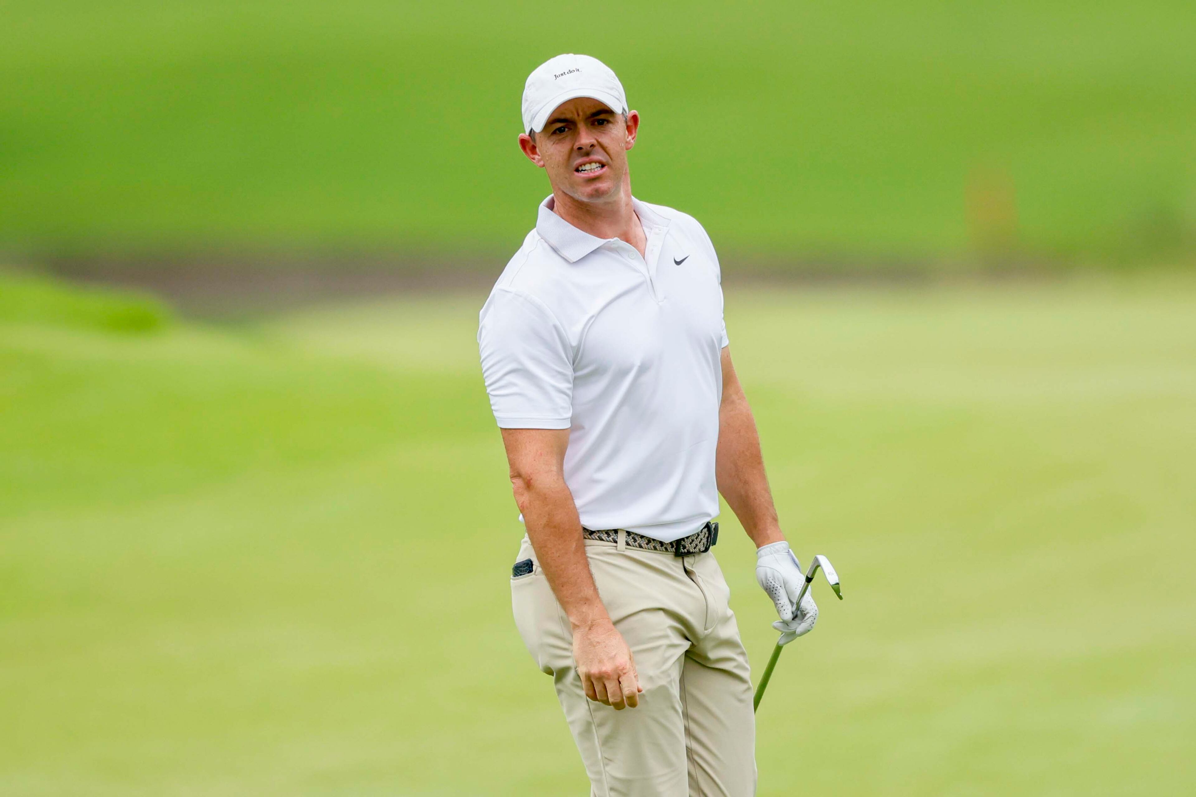 Rory McIlroy, from Northern Ireland, watches where his ball landed on the first fairway during the first round of the PGA Tour Championship at East Lake Golf Club on Thursday, Aug. 21, 2025, in Atlanta. (Miguel Martinez/ AJC)