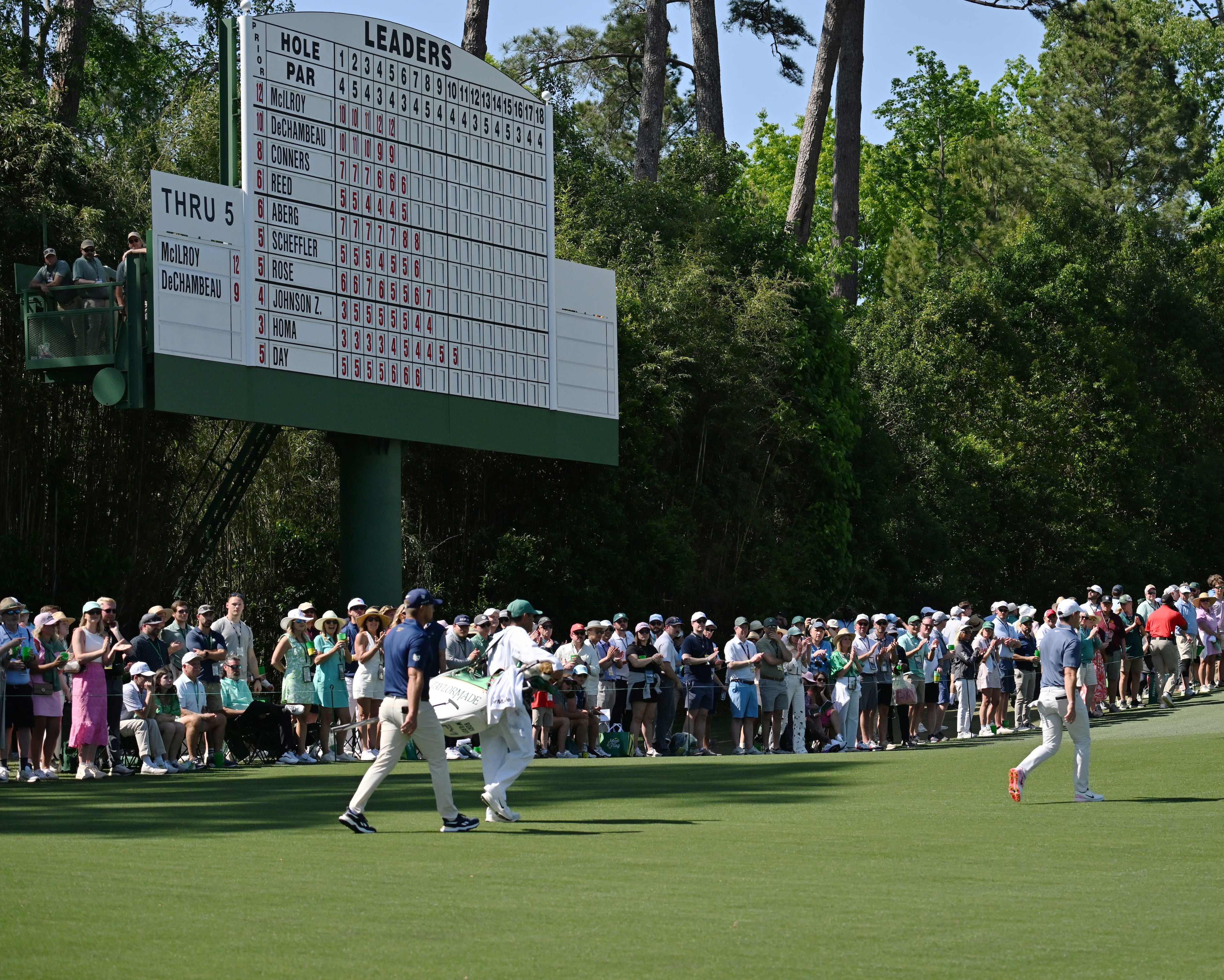Rory McIlroy and Bryson DeChambeau walk up sixth fairway during final round of the Masters golf tournament, at Augusta National Golf Club, Saturday, April 13, 2025, in Augusta, Ga. (Hyosub Shin / AJC)