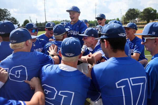 Players, including Etowah outfielder Trevor Condon, rally before the game against Harrison High School during the High School Baseball Playoffs at Etowah High School in Woodstock on April 24, 2026. (Arvin Temkar/AJC)